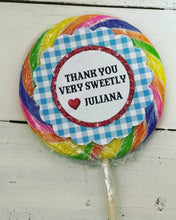 Load image into Gallery viewer, Gingham and Glitter Mini and Jumbo swirl pop party favors. Inspired by the Wizard of oz, Label is deigned with scalloped edges, a blue and white gingham boarder, and a white center outlined in red glitter. Pops are personalized with your custom message.