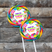 Load image into Gallery viewer, Two jumbo swirl pop lollipops with personalized labels saying &#39;Thank you for my first birthday!&#39; in colorful letters, displayed on a wooden background.

